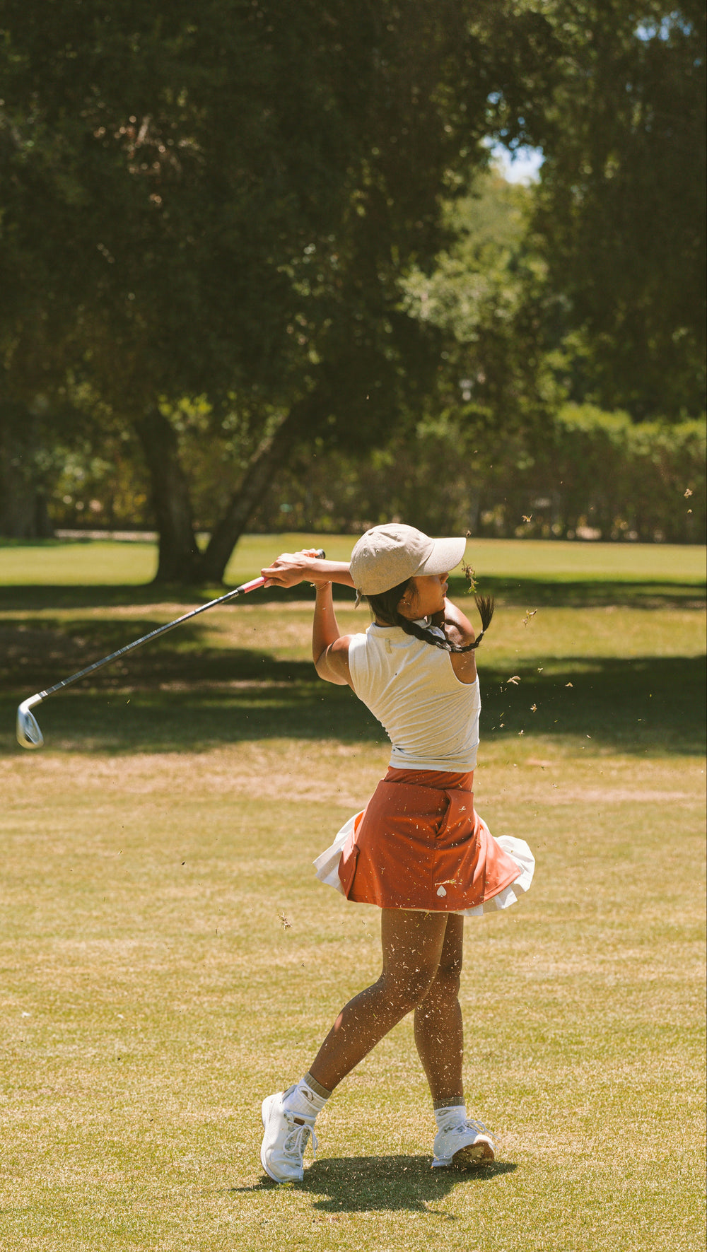 Women in a gorgeous golf skirt- playing on a course 